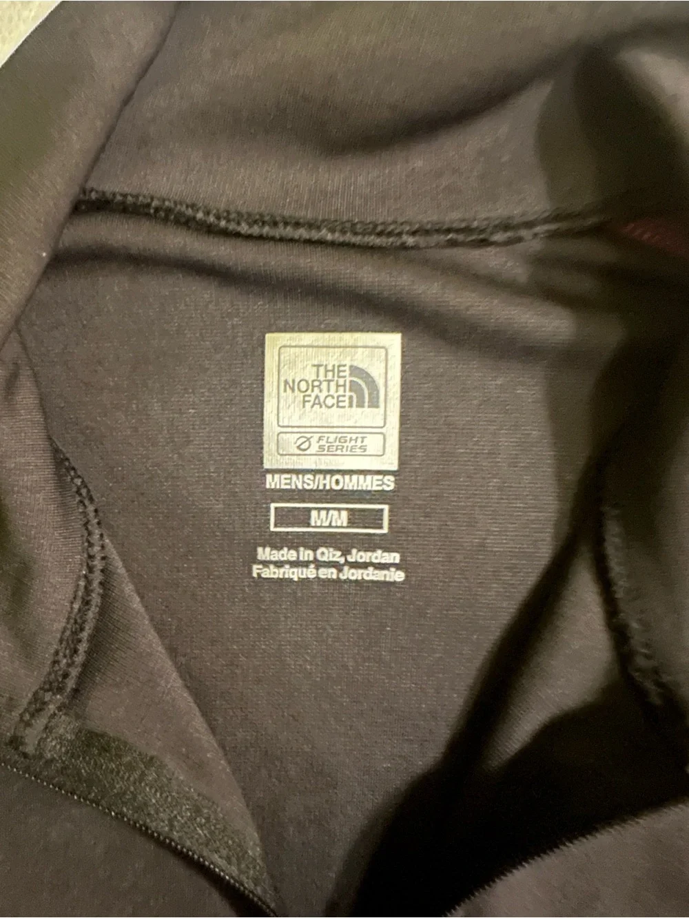 The North Face Men’s Black Half-Zip Performance Jacket with Red Accents